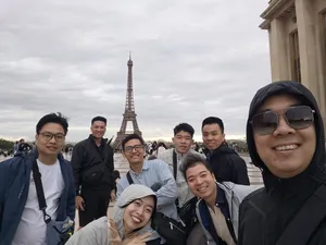 Team selfie at the Eiffel Tower