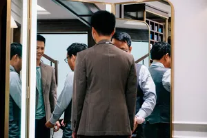 Suit fitting in the mirror