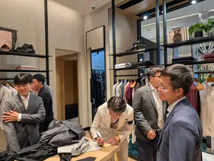 Getting fitted at the tailor